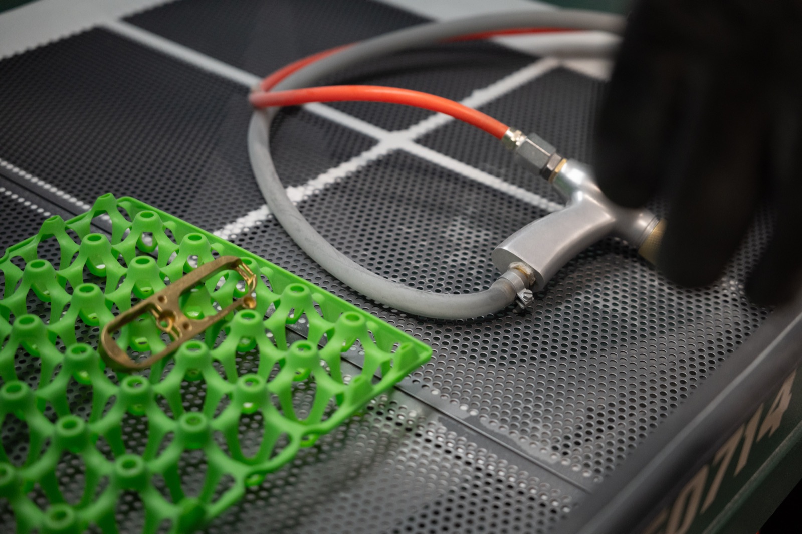 Aluminum parts on the anodizing line receiving a colored finish
