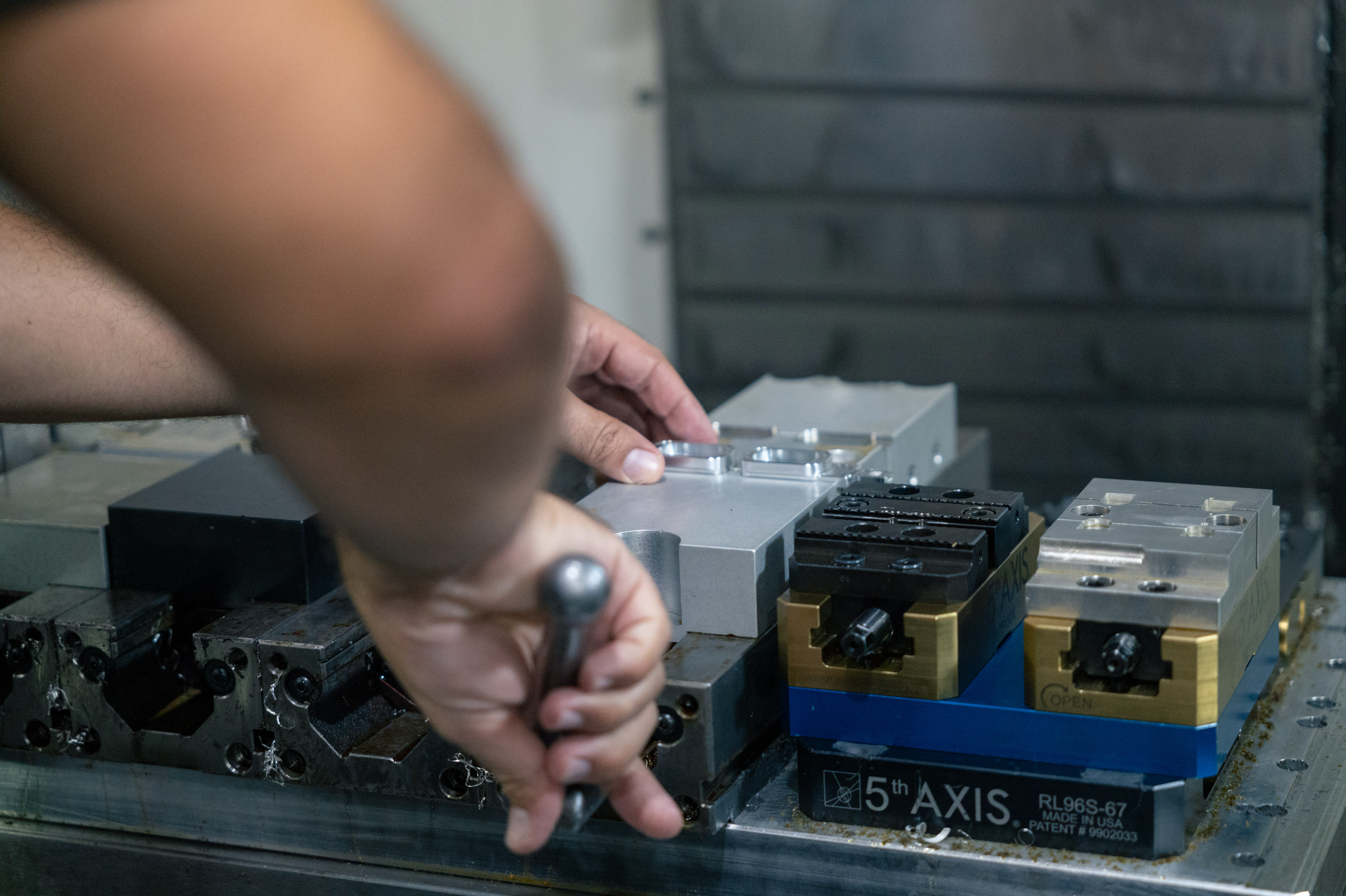 Machinist at a CNC machine on the shop floor