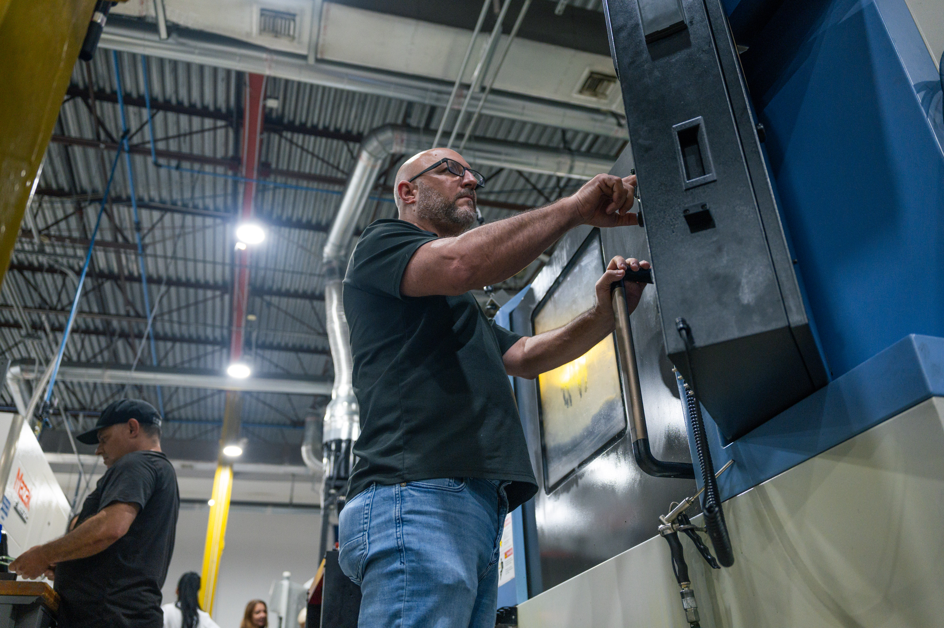 Operator running a machine on the shop floor